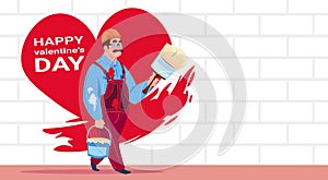 Man Painter Paint Red Heart Shape On White Brick Wall Happy Valentines Day Decoration Concept