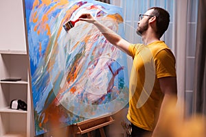 Man painting a masterpiece