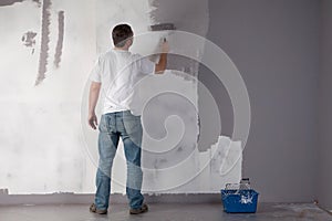 Man painting a wall.