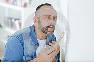 man painting wall