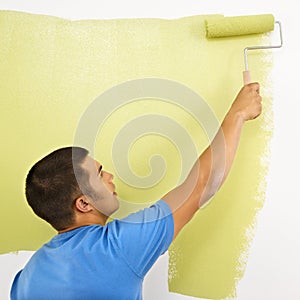 Man painting wall.