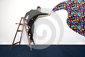 Man Painting White Wall with Wild Colors