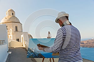 Man paints sea and Church