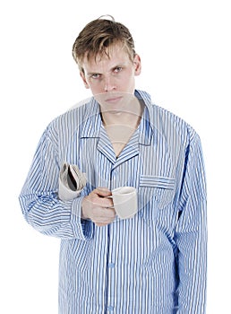 Man in pajamas with newspaper photo