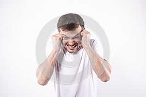 Man in panic attack. Hands at temples, teeth clenched Isolated, white background