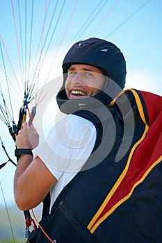 Man, parachute or launch in nature for sport, happy or exercise for healthy adventure for extreme fitness. Person