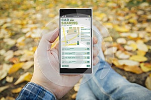 man in the park car sharing smartphone