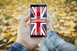 man in the park learn english smartphone