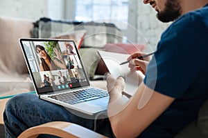 Man participate video conference looking at laptop screen during virtual meeting, videocall webcam app for business