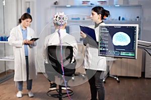 Man patient wearing performant eeg headset scanning brain