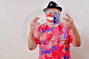 Man with patriotic shirt making the V for voted sign