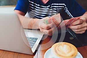 Man paying bill in cafe. He putting money. Busy man having lunch in restaurant. service concept.