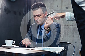 Man paying with credit card at the restaurant