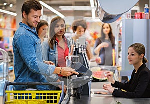 Man paying with NFC in a grocery store