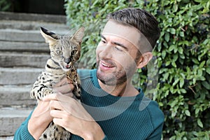 Man with pedigreed Savannah cat