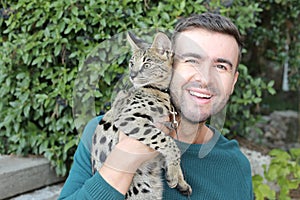 Man with pedigreed Savannah cat