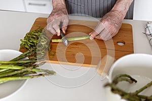 Man peeling asparagus