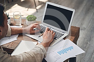 Man with a pen sitting at the table photo