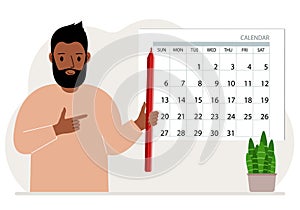 A man with a pencil in his hand creates a calendar. Planning and time management, responsible employee plans meetings