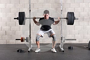 Man performing a crossfit back squat exercise