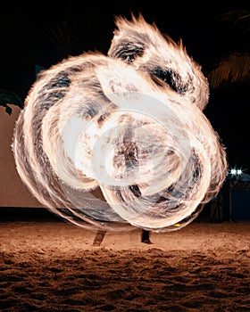 Man performing fire show at night