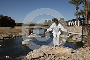 Man Performing Tai Chi on rock