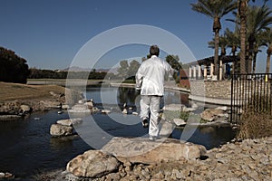 Man Performing Tai Chi on rock