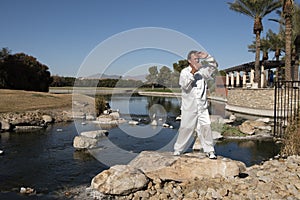 Man Performing Tai Chi on rock