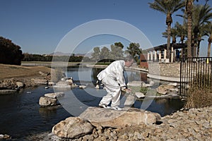 Man Performing Tai Chi on rock