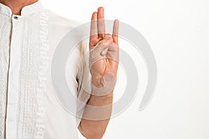 Man performing various yoga hand gestures called `mudras`