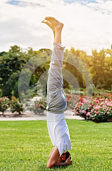 Man performing yoga in the park