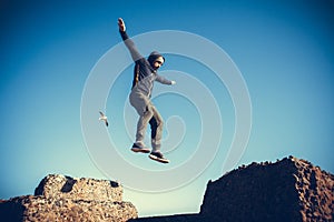 Man performs freerunning jump on stones