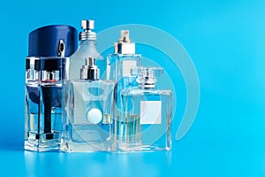 Man perfume bottle on blue background close up