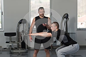 Man With Personal Trainer Train On Bosu Ball