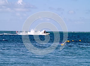 Man on personal watercraft photo