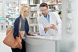 Man, pharmacist and help customer, prescription and explain instructions for medicine, vitamins and wellness. Pharmacy