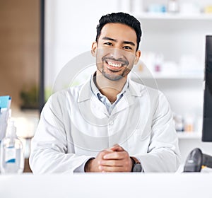 Man, pharmacy and portrait with happy and smile of pharmacist ready for healthcare support and work. Clinic, doctor and