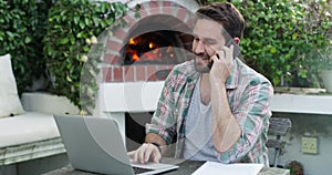 Man, phone call and outdoor with laptop for remote work from home in garden, talk or planning for deal. Entrepreneur
