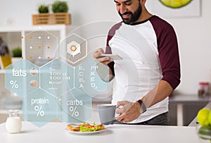 Man with phone and food nutritional value chart