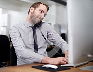 Man, phone and landline in office for customer service with telemarketing, help desk and happy with computer. Call