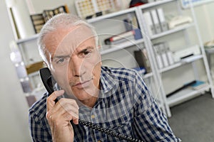 Man on phone in office