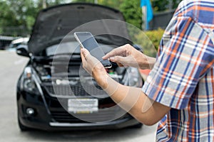 Man Phoning For Help with a broken down car