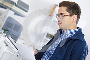 Man photocopying a document