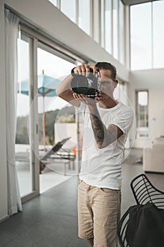 Man photographer is shooting in the villa