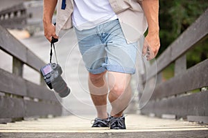 man photographer walking up steps