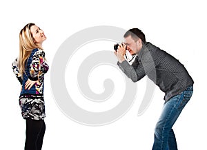 A man photographing a beautiful young woman