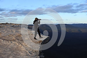 Man photographing the landscape from Lincoln Rock Lookout at sun