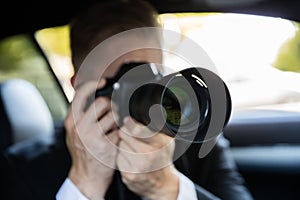 Man Photographing With SLR Camera