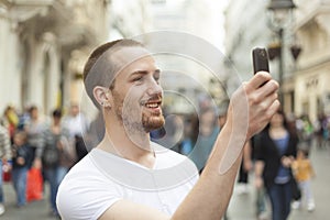 Man photographing with smart-phone