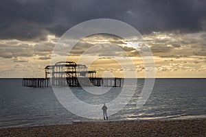 Man photographing the west pier brighton